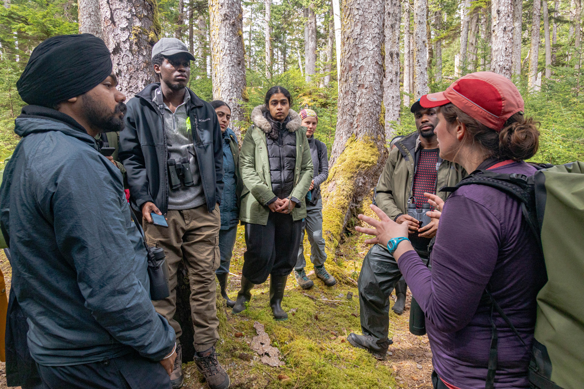 Biologist Rian Dickson tells students about ancient murrelet nesting habits.